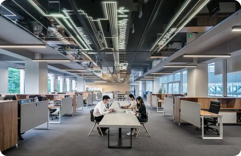people sitting at a table in an office