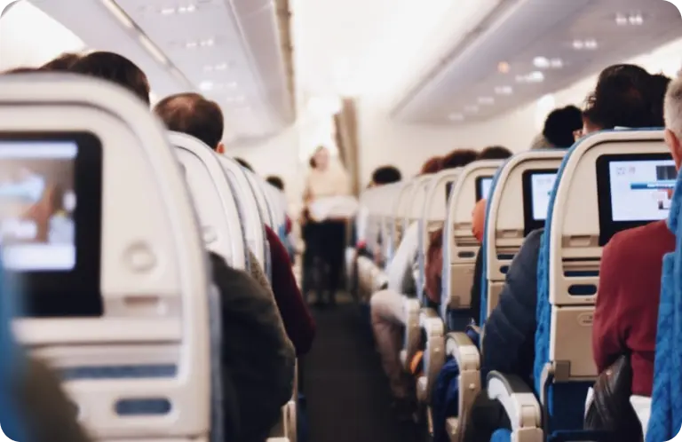 a group of people sitting in an airplane